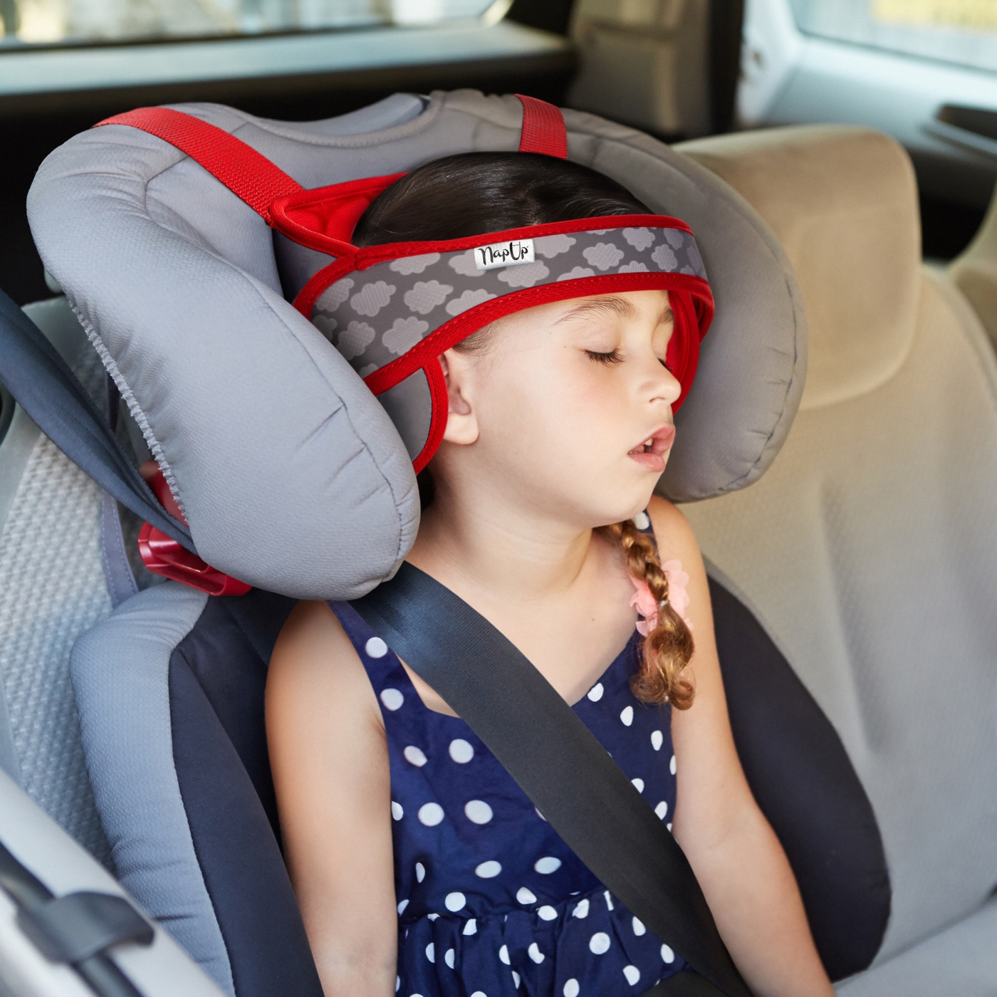 Two children traveling safely with NapUp car-seat head support